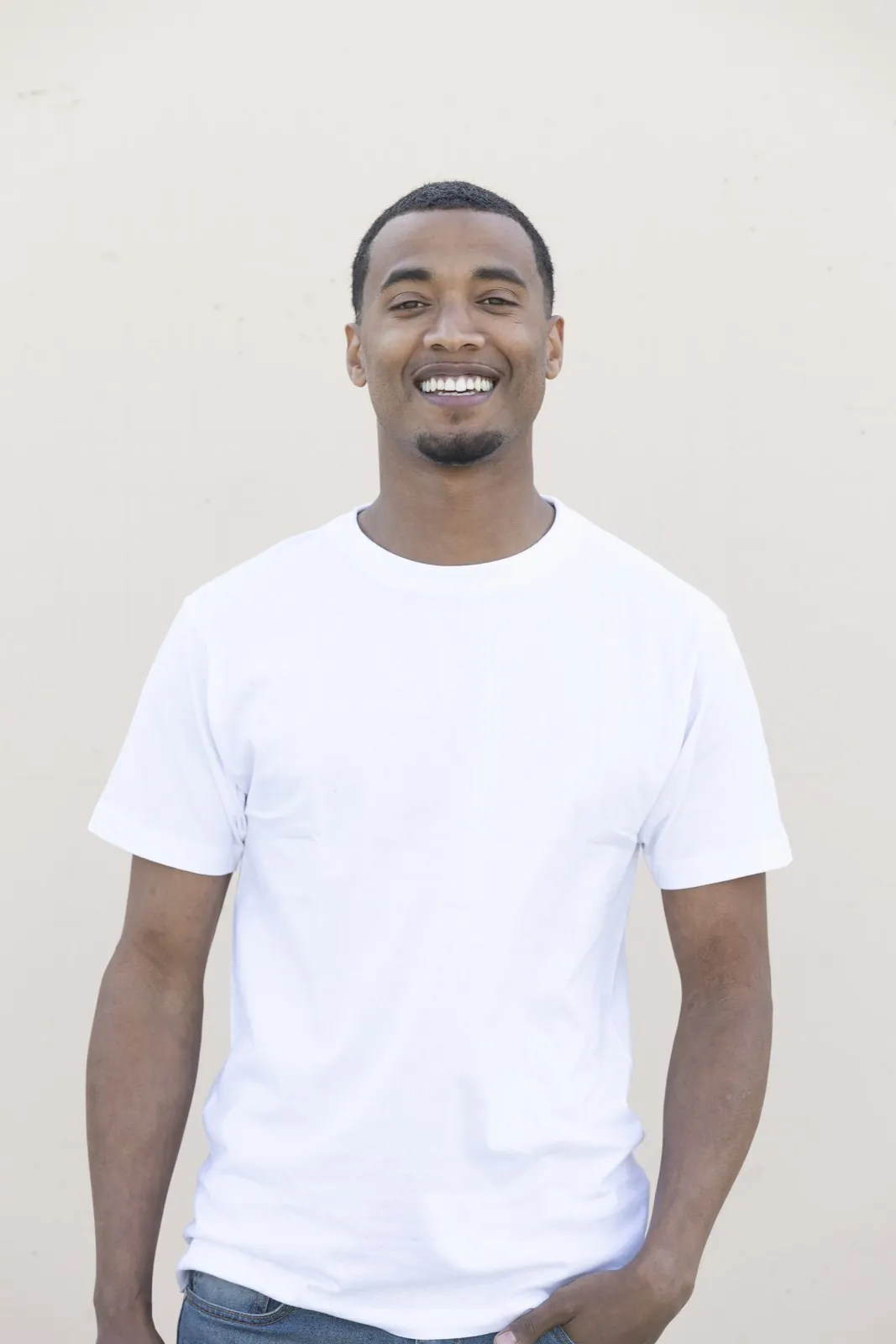 Vonté Smith smiling in a white tee