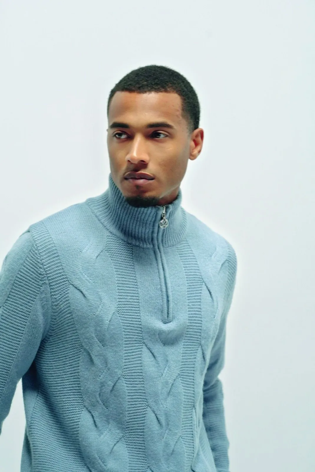 Vonté Smith — Light-blue cable-knit quarter-zip, clean studio portrait