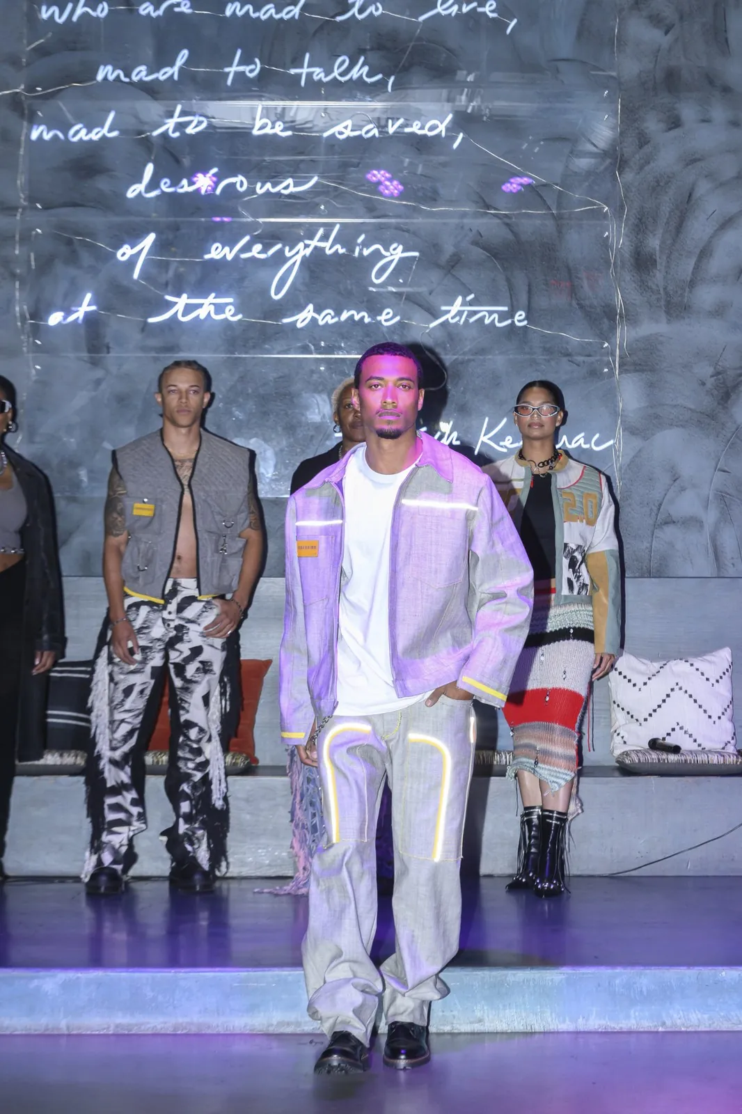 Vonté Smith — Walking the runway in a lilac reflective jacket
