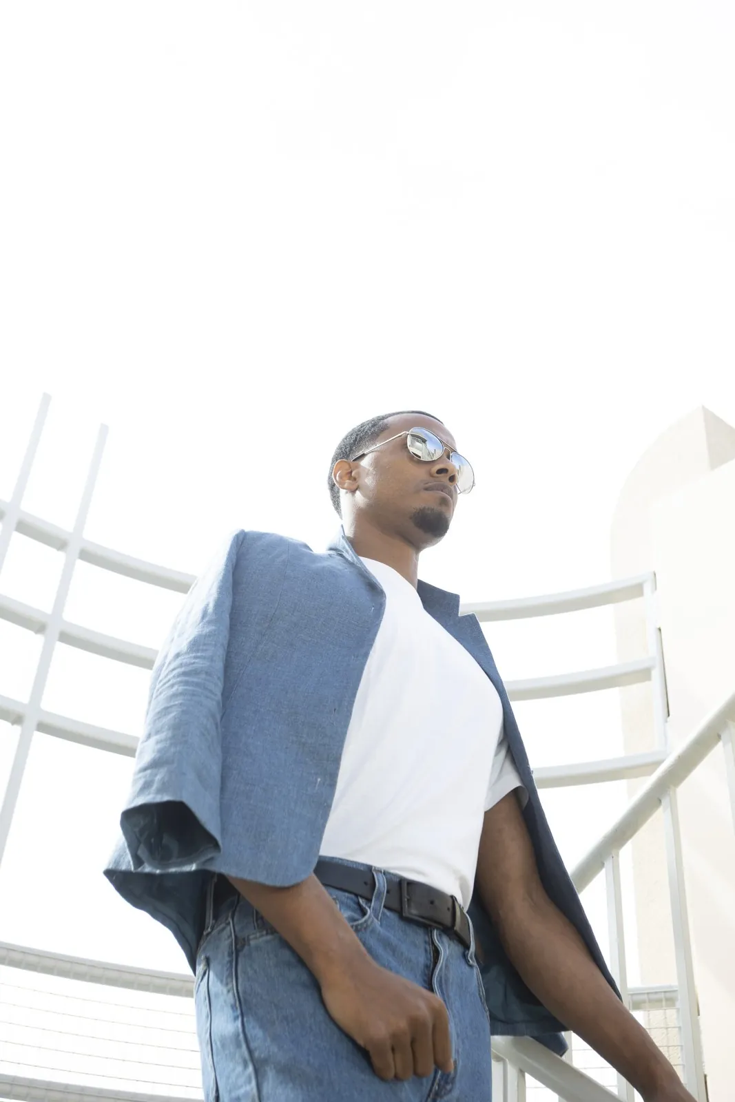 Vonté Smith — Sunglasses, denim and white tee, low angle