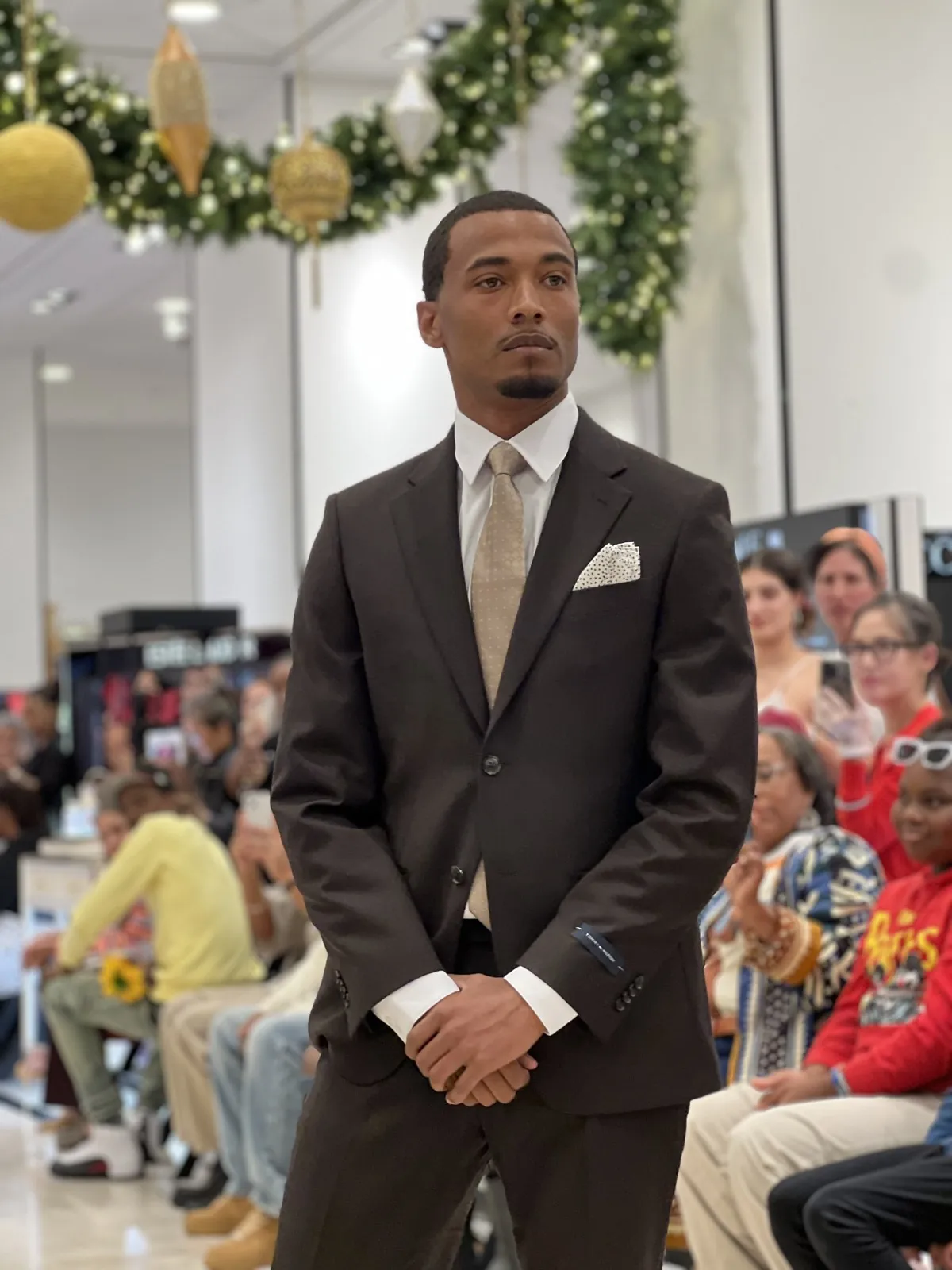 Vonté Smith — Brown suit on a holiday fashion show runway